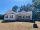 Charming single-story home with white siding, black shutters, and a welcoming front porch at 539 Mulberry Rd, Spring Hope, NC 27882