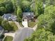 Stunning aerial view of home on a cul-de-sac with a large, private lot at 6 Beltre Ct, Durham, NC 27705