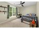 Cozy bedroom with a playful design, featuring a comfortable bed, a desk, and shelves creating a fun and inviting space at 6 Beltre Ct, Durham, NC 27705