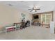 Spacious bonus room featuring a ceiling fan, TV, and ample space for activities and storage at 6 Beltre Ct, Durham, NC 27705