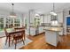 Eat-in kitchen with granite countertops, stainless steel appliances, and hardwood flooring at 6 Beltre Ct, Durham, NC 27705