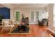 Spacious living room with hardwood floors, plenty of natural light, and neutral tones at 6 Beltre Ct, Durham, NC 27705