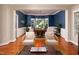 Comfortable seating area with wood floors, stylish lighting and dining room access at 6 Beltre Ct, Durham, NC 27705