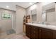 Bathroom featuring double sinks, modern vanity, and a walk-in shower at 6082 Zachary Lane Ln # 1S, Oxford, NC 27565