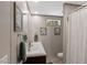 Bathroom featuring double sinks, framed art, and a small window providing natural light at 6082 Zachary Lane Ln # 1S, Oxford, NC 27565