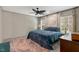 Serene bedroom with a comfortable queen-sized bed and ample natural light at 6082 Zachary Lane Ln # 1S, Oxford, NC 27565