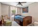 Bedroom features natural light, an area rug and wooden twin bed frame with drawers at 6082 Zachary Lane Ln # 1S, Oxford, NC 27565