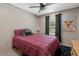 Cozy bedroom with a ceiling fan, natural light, and a decorative painting at 6082 Zachary Lane Ln # 1S, Oxford, NC 27565