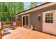 A beautiful outdoor deck with sliding glass door and chairs for relaxing at 6082 Zachary Lane Ln # 1S, Oxford, NC 27565