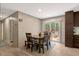 Bright dining area with a table for four and access to the outdoor deck at 6082 Zachary Lane Ln # 1S, Oxford, NC 27565