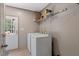 Laundry room features a washer, dryer, shelving and access to the back yard at 6082 Zachary Lane Ln # 1S, Oxford, NC 27565