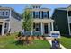 Charming two-story home with blue siding, black shutters, and a well-manicured front yard at 736 Georgias Landing Pkwy # 7, Raleigh, NC 27603