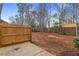Backyard with wooden fence and trees at 752 Wickham Ridge Rd, Apex, NC 27539