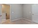 Neutral bedroom features beige carpet and light gray paint at 752 Wickham Ridge Rd, Apex, NC 27539