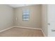 Bedroom features neutral walls, carpet flooring and a large window with natural light at 752 Wickham Ridge Rd, Apex, NC 27539