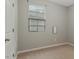 Neutral bedroom features beige carpet and a window with blinds at 752 Wickham Ridge Rd, Apex, NC 27539