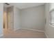 Neutral bedroom features beige carpet and a window at 752 Wickham Ridge Rd, Apex, NC 27539