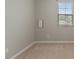 Neutral bedroom features beige carpet and a window with blinds at 752 Wickham Ridge Rd, Apex, NC 27539