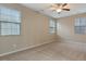 Neutral bedroom features carpet, a ceiling fan, and windows at 752 Wickham Ridge Rd, Apex, NC 27539