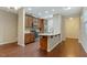 Spacious kitchen with stainless steel appliances, granite countertops and wooden floors at 752 Wickham Ridge Rd, Apex, NC 27539