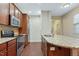 Kitchen boasts granite countertops, stainless appliances, and ample cabinet space at 752 Wickham Ridge Rd, Apex, NC 27539