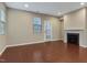 Living room with neutral walls, hardwood floors, a fireplace, and plenty of natural light at 752 Wickham Ridge Rd, Apex, NC 27539