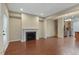 Living room with fireplace, hardwood floors and an open concept design connecting the kitchen at 752 Wickham Ridge Rd, Apex, NC 27539