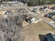 Aerial view of a home in a beautiful neighborhood featuring mature trees and well-maintained yards at 76 Freewill Pl, Raleigh, NC 27603