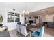 Dining area showcasing stylish table, seating for six, modern chandelier, and views to living spaces at 76 Freewill Pl, Raleigh, NC 27603