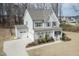 Beautiful two-story home with attached garage and classic architectural details and manicured lawn at 76 Freewill Pl, Raleigh, NC 27603