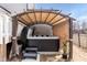 Outdoor hot tub with awning, set in private backyard and light gray siding at 76 Freewill Pl, Raleigh, NC 27603