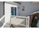 Exterior view of hot tub deck showing siding, sliding glass doors, and hot tub awning at 76 Freewill Pl, Raleigh, NC 27603