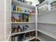 Walk-in pantry with well-organized shelving provides lots of storage space at 76 Freewill Pl, Raleigh, NC 27603