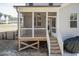 Exterior angle of screened-in porch showing steps and light gray siding at 76 Freewill Pl, Raleigh, NC 27603