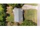 Aerial view of a single-Gathering home with a driveway, green lawn, and mature trees at 765 S Hollybrook Rd, Wendell, NC 27591