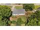 Aerial view of a single Gathering home with a gray roof and mature trees surrounding the property at 765 S Hollybrook Rd, Wendell, NC 27591