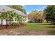Expansive backyard with lush lawn and tropical plants at 765 S Hollybrook Rd, Wendell, NC 27591