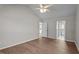 Bedroom with wood flooring with entrances to a bathroom and another room at 765 S Hollybrook Rd, Wendell, NC 27591