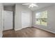 Bedroom featuring wood flooring, neutral paint, closet, natural lighting, and a ceiling fan at 765 S Hollybrook Rd, Wendell, NC 27591