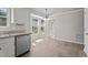 Dining area featuring a large window, hardwood flooring, and a granite countertop at 765 S Hollybrook Rd, Wendell, NC 27591