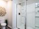 Clean bathroom showcasing a glass-enclosed shower and stylish gold leaf wall decor at 80 Willow Green Dr, Clayton, NC 27527