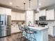 Kitchen with white cabinets, stainless steel appliances, granite countertop, and breakfast bar at 80 Willow Green Dr, Clayton, NC 27527