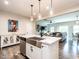 Open concept living room with pendant lighting, stainless steel sink and breakfast bar at 80 Willow Green Dr, Clayton, NC 27527