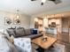 Open concept living room with hardwood floors flows into a kitchen with stainless steel appliances at 80 Willow Green Dr, Clayton, NC 27527