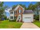 Attractive two-story brick and siding home with an attached garage at 805 Penncross Dr, Raleigh, NC 27610