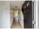 Inviting foyer with hardwood floors, staircase, and neutral paint at 805 Penncross Dr, Raleigh, NC 27610