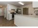 Well-lit kitchen with stainless steel appliances, breakfast bar and view into dining area at 805 Penncross Dr, Raleigh, NC 27610