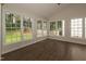 Bright sunroom with multiple windows overlooking a backyard at 805 Penncross Dr, Raleigh, NC 27610