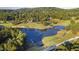 Scenic aerial view of the golf course, with pond, trees, and well-manicured greens at 81502 Alexander, Chapel Hill, NC 27517