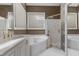 Modern bathroom with a corner soaking tub, glass shower, and updated fixtures at 81502 Alexander, Chapel Hill, NC 27517